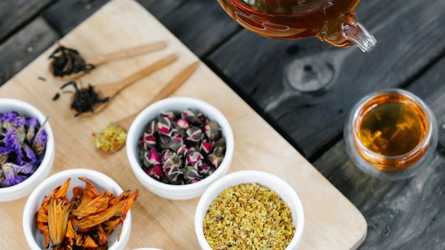 assorted herbs on wooden chopping board